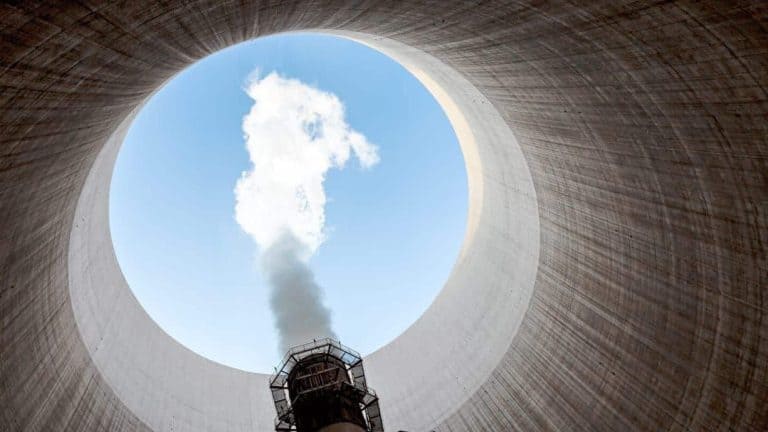 A view from inside a cooling tower with steam rising, possibly related to the nuclear renaissance.